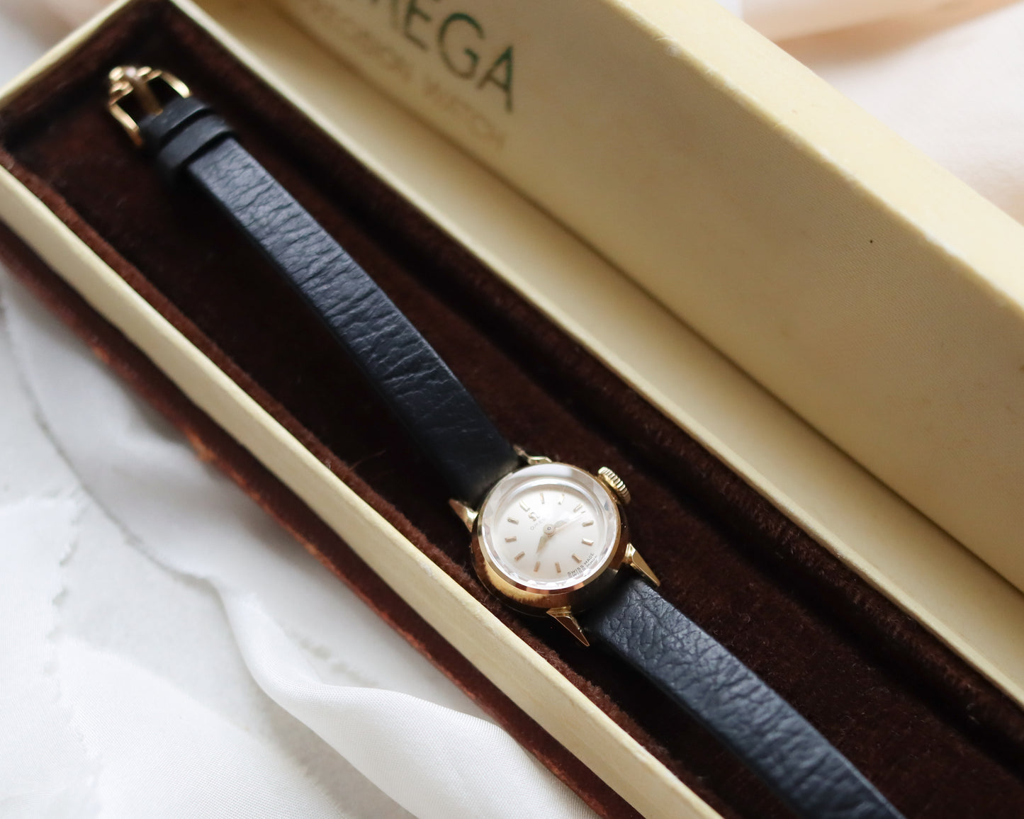 18ct gold Omega Saphette with black leather strap 1958