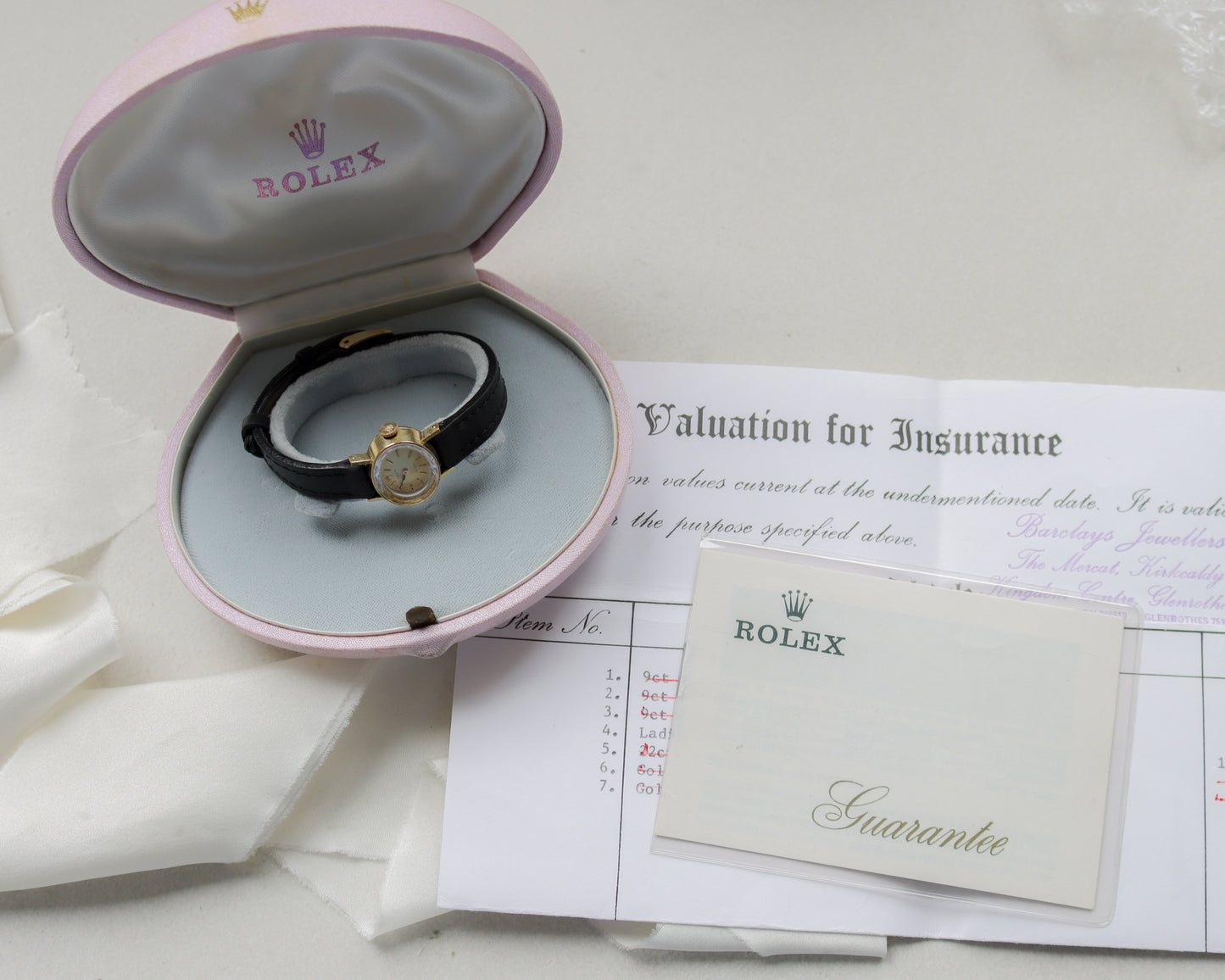 18ct gold Rolex Precision black leather watch with pink clamshell box