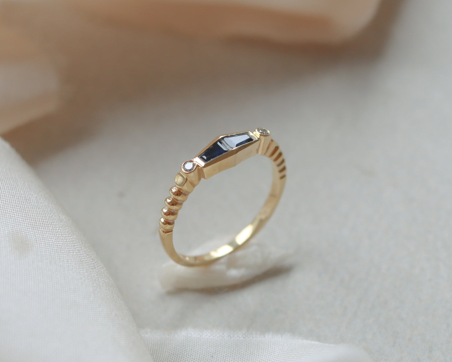 Statement 18ct gold trapeze sapphire and diamond ring UK K
