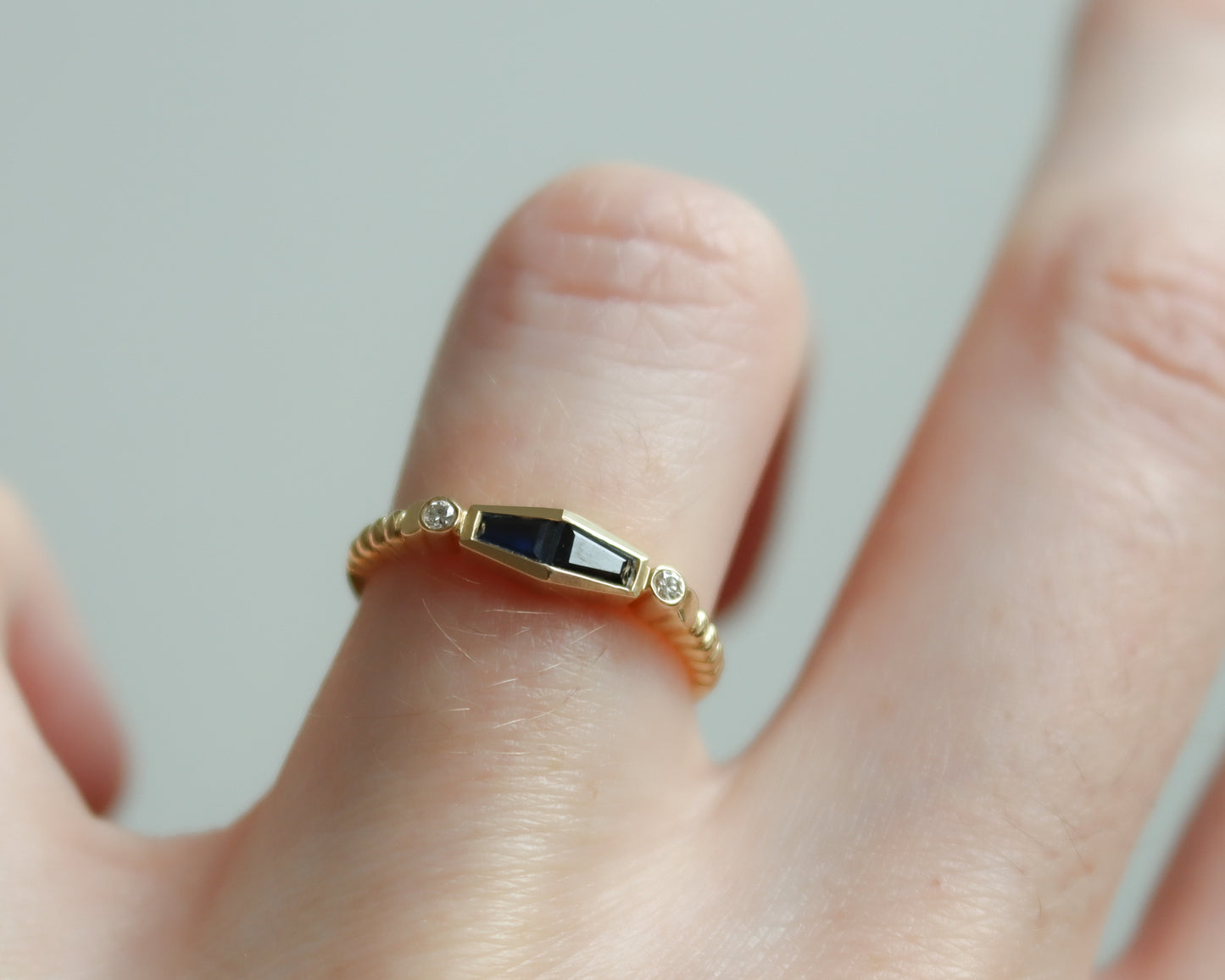 Statement 18ct gold trapeze sapphire and diamond ring UK K