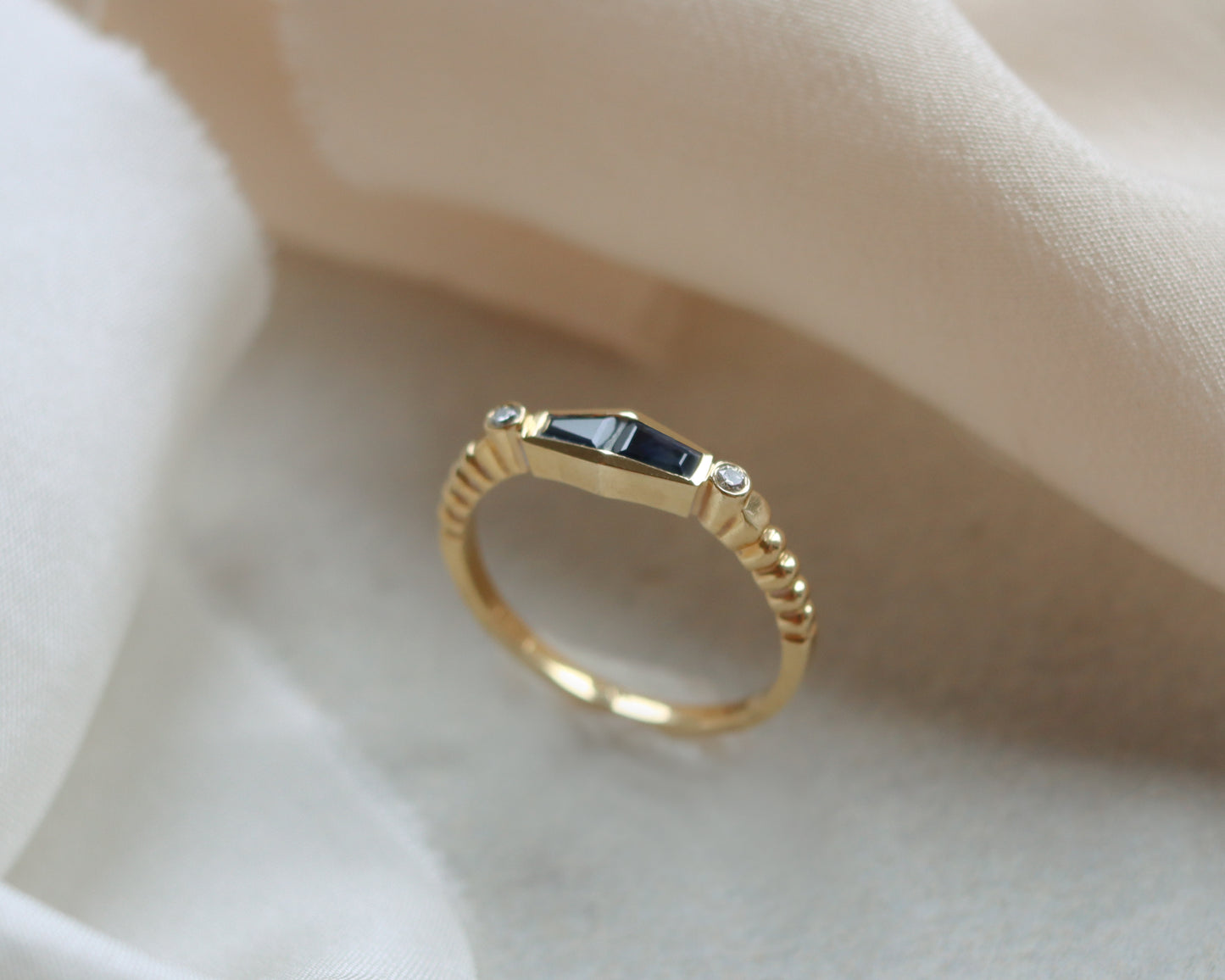 Statement 18ct gold trapeze sapphire and diamond ring UK K