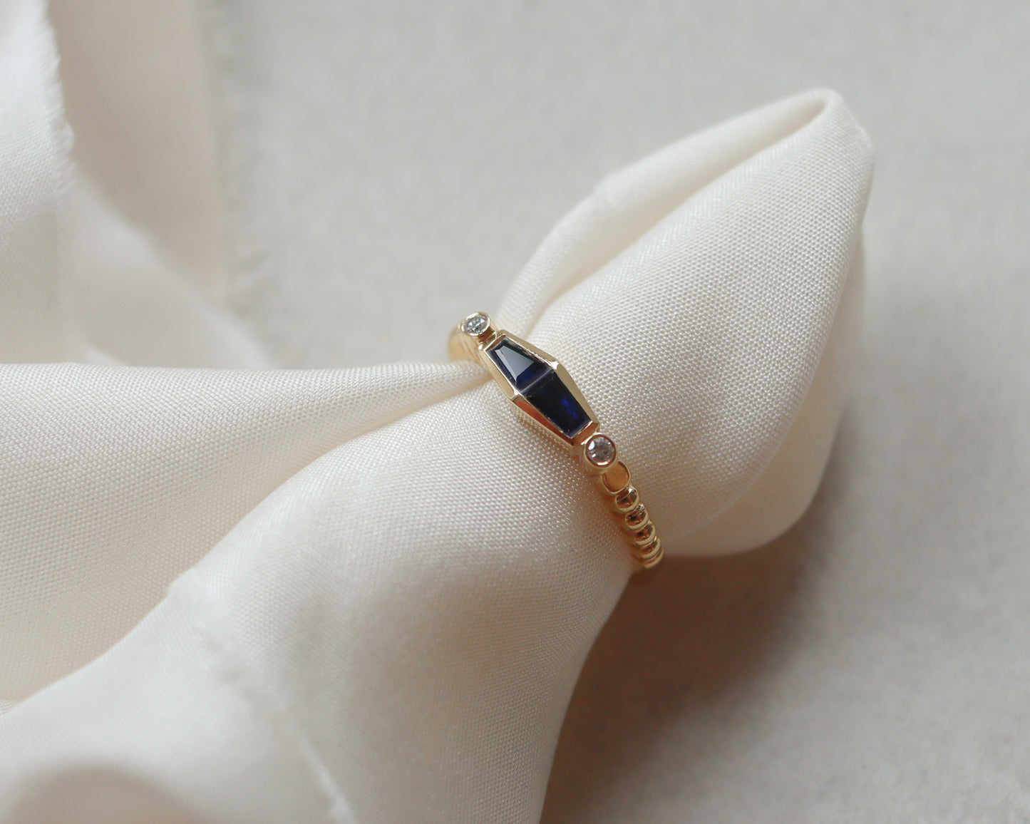 Statement 18ct gold trapeze sapphire and diamond ring UK K