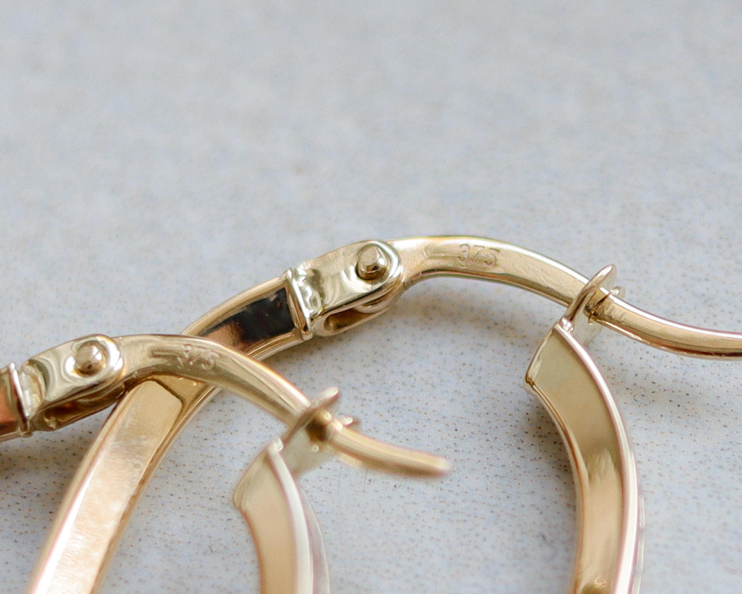 Deposit 9ct gold diamond channel set hoops