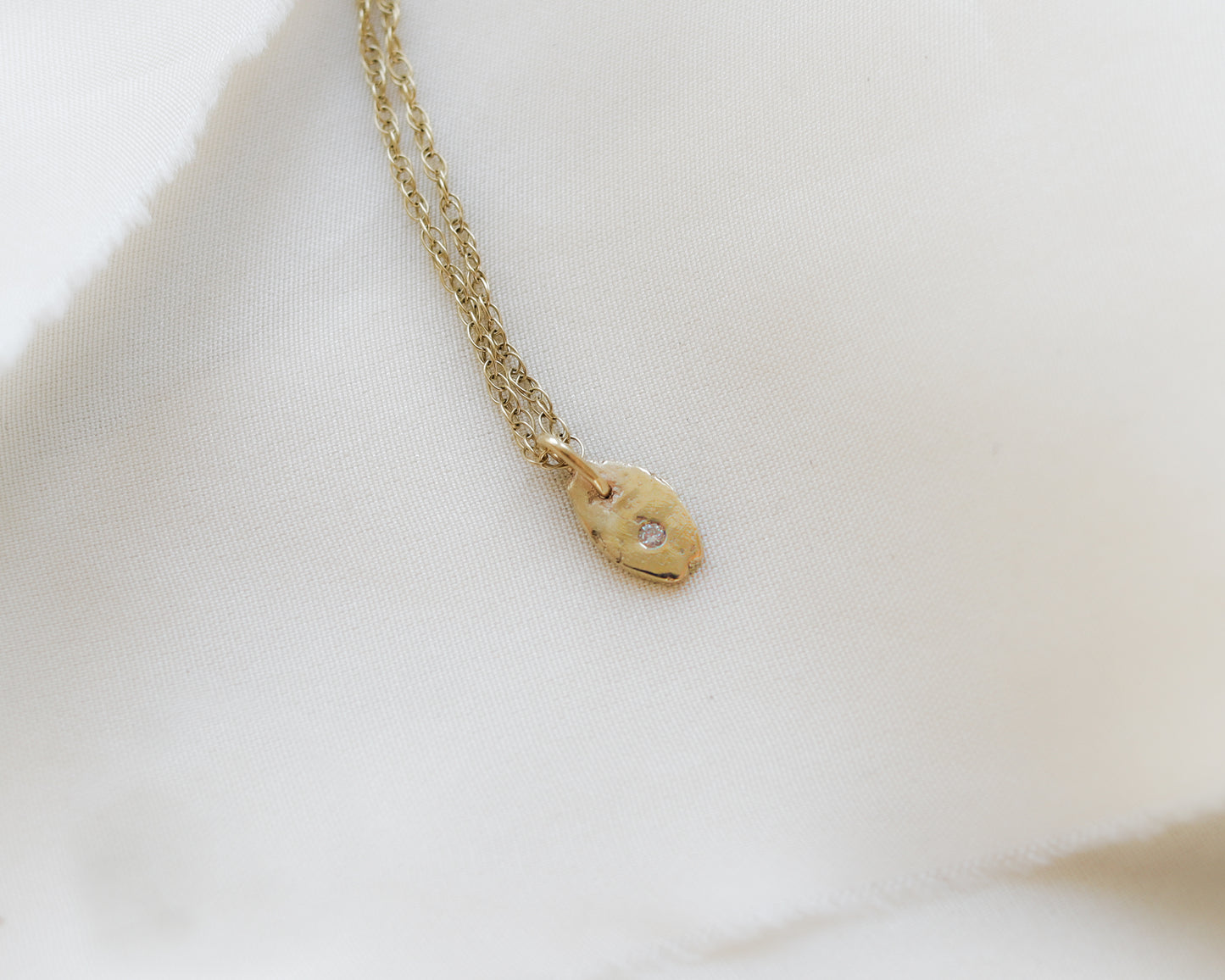9ct yellow gold rustic oval smaller diamond charm pendant