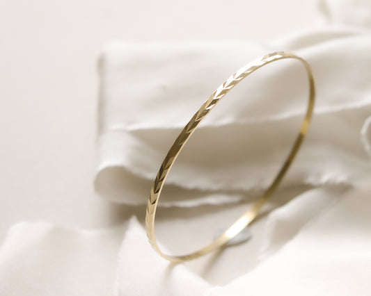 9ct gold chevron patterned bangle