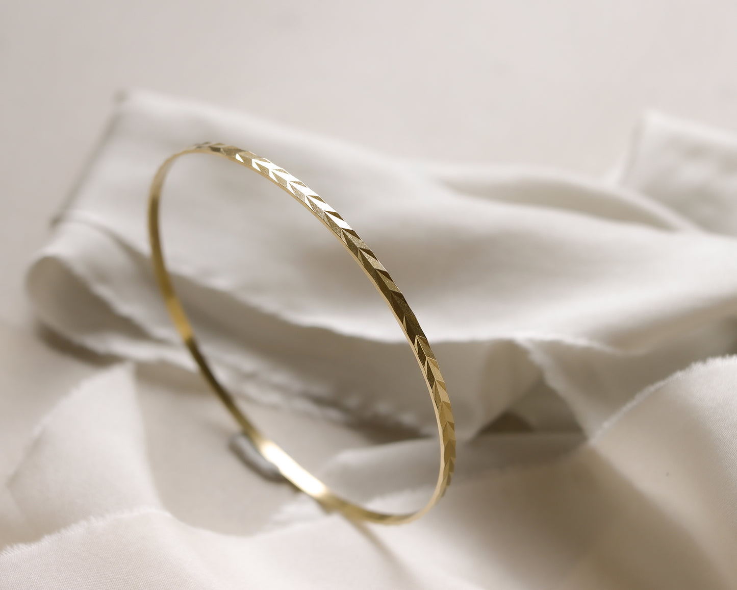 9ct gold chevron patterned bangle