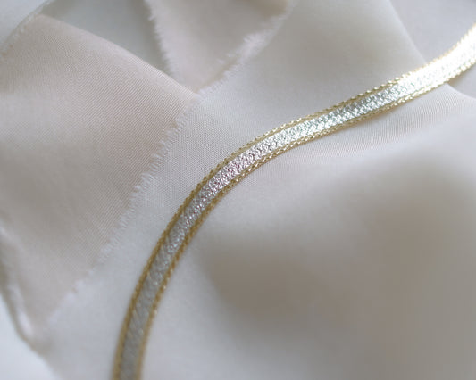 flat link herringbone bracelet in 9ct white and yellow gold