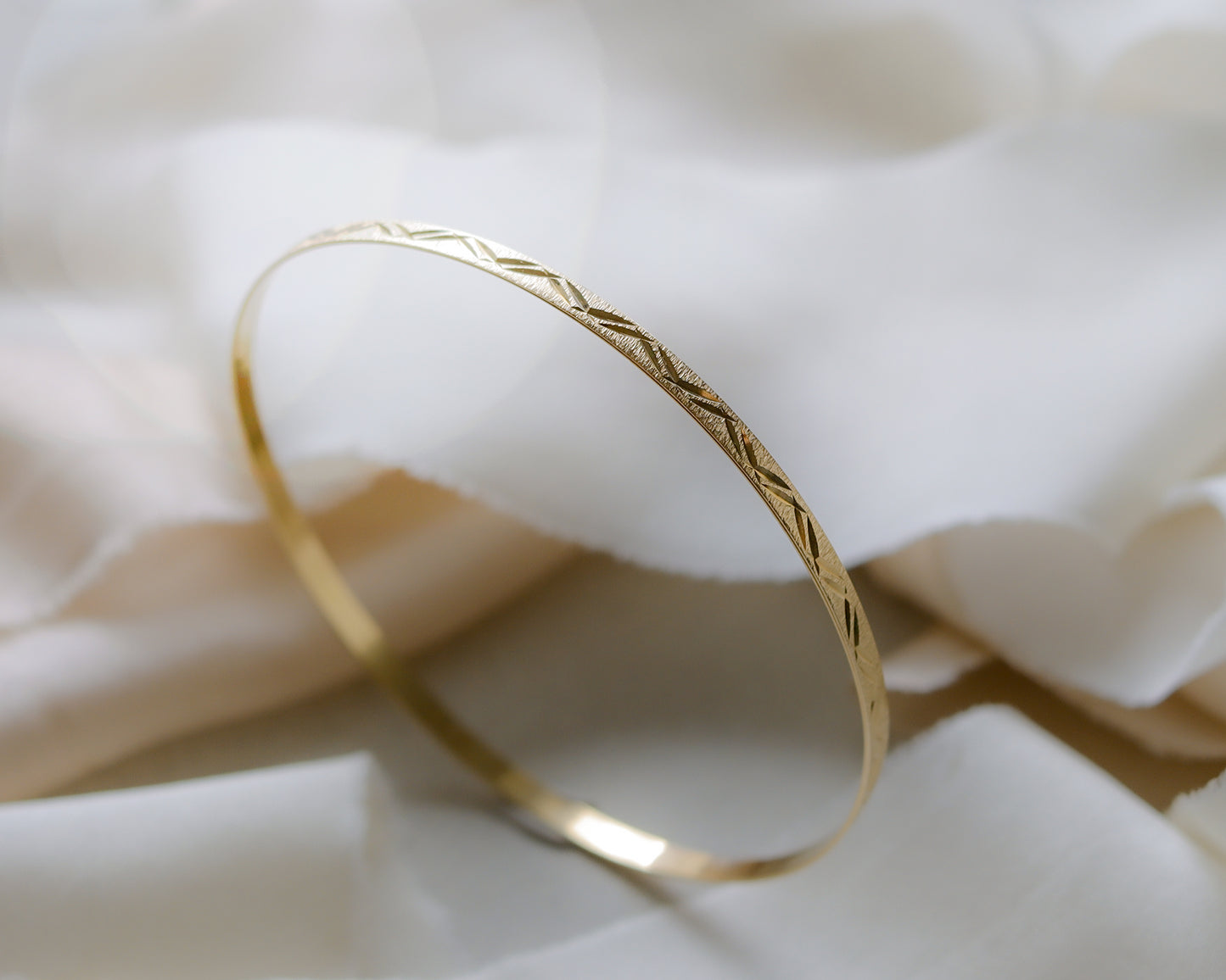 9ct gold textured, engraved bangle