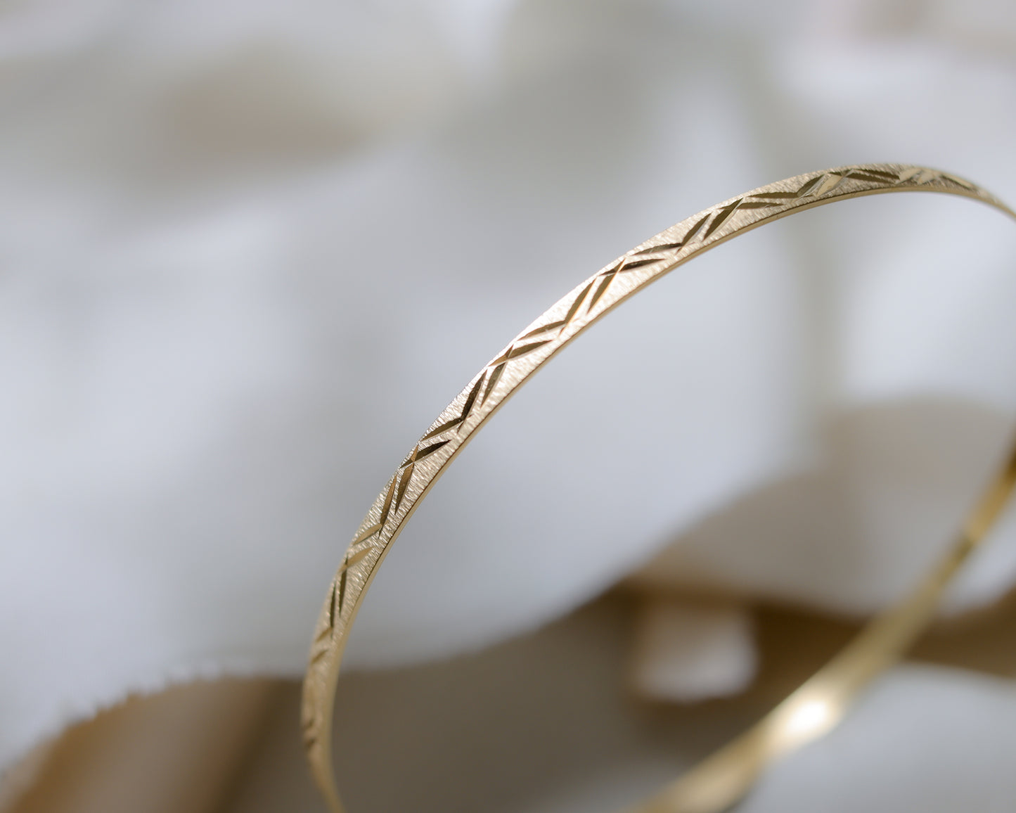 9ct gold textured, engraved bangle