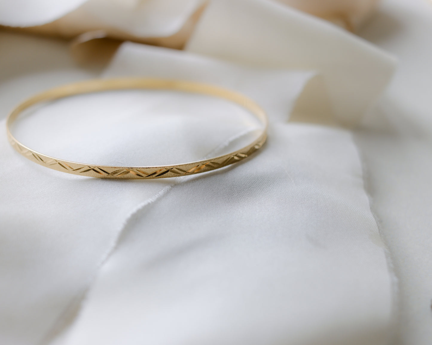 9ct gold textured, engraved bangle