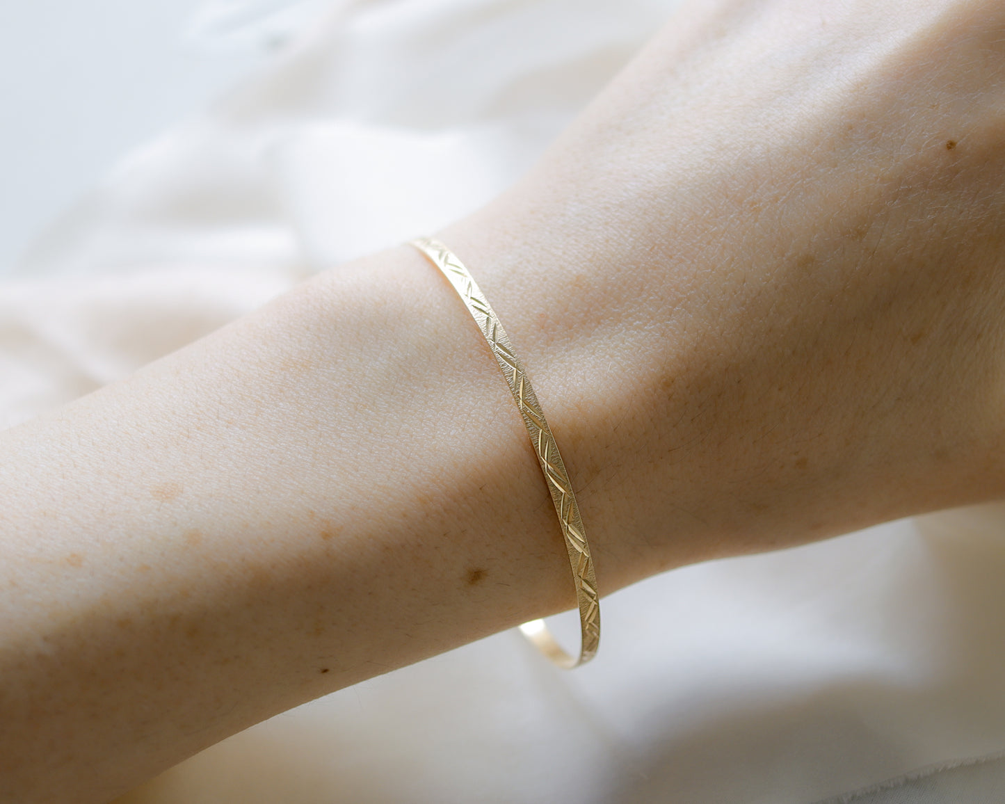 9ct gold textured, engraved bangle