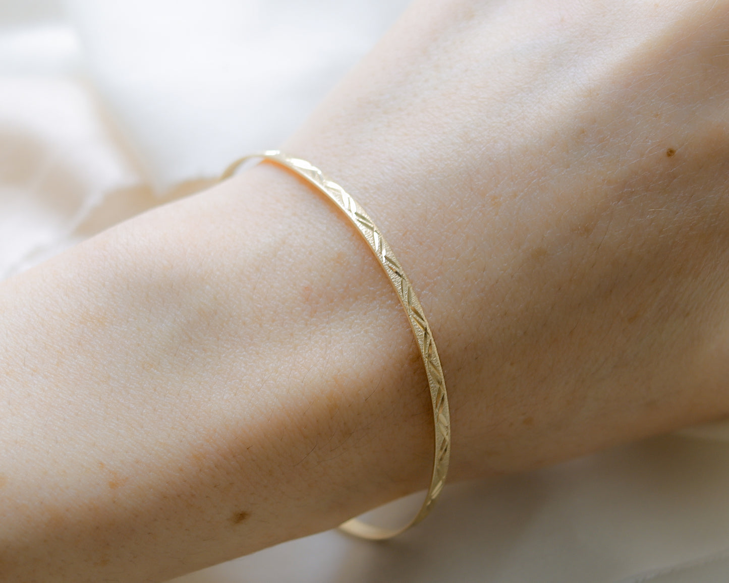 9ct gold textured, engraved bangle