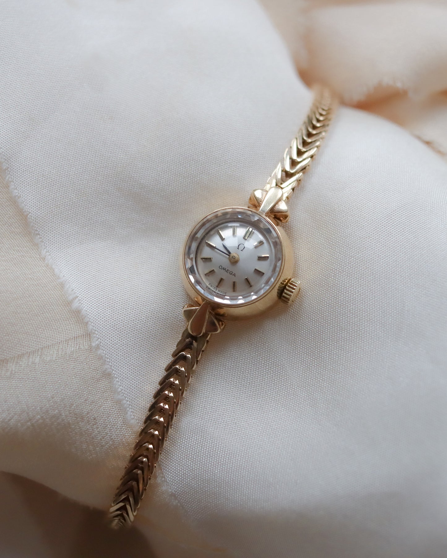 9ct Gold Omega faceted crystal herringbone watch - 1965