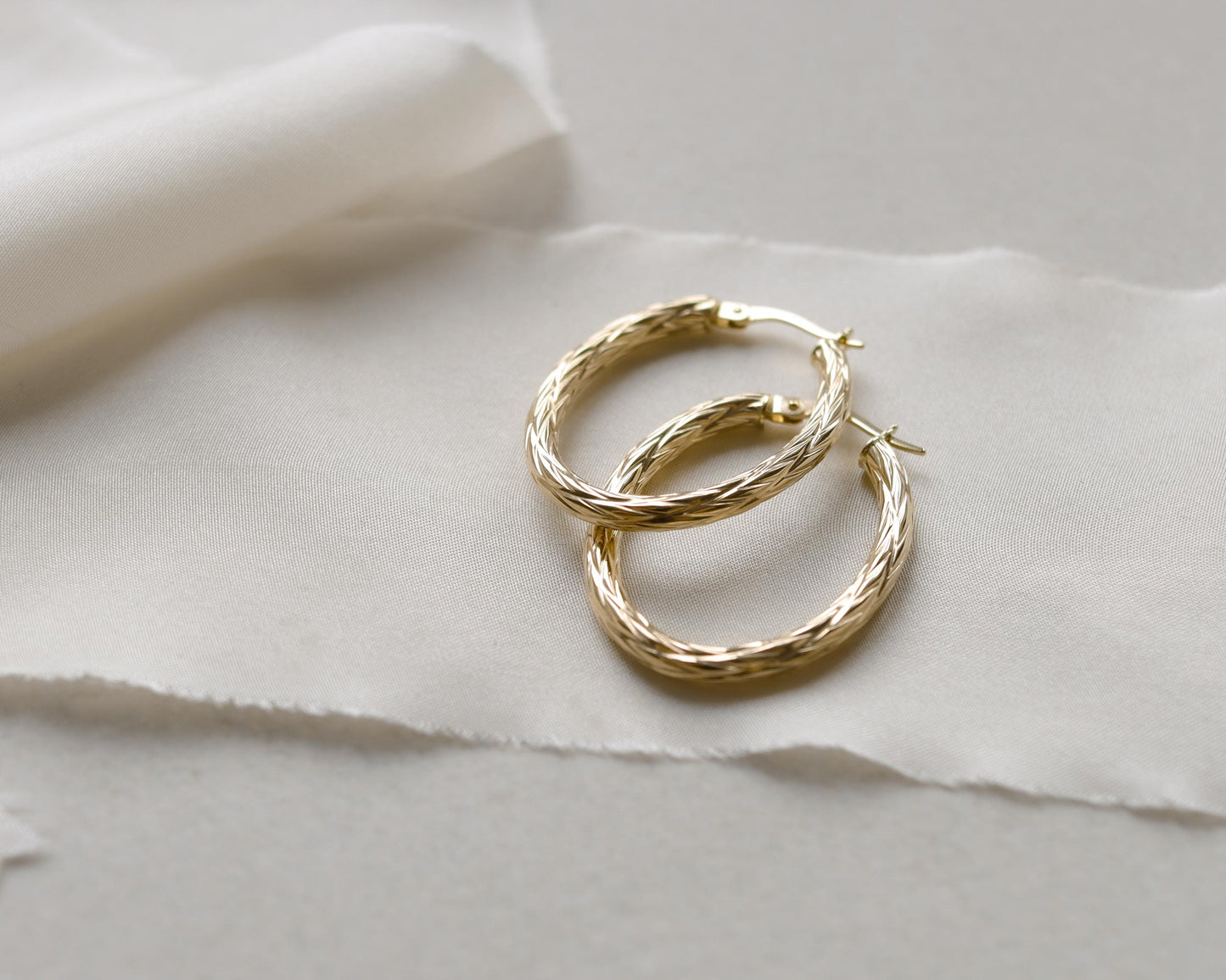 9ct gold textured oval hoop earrings