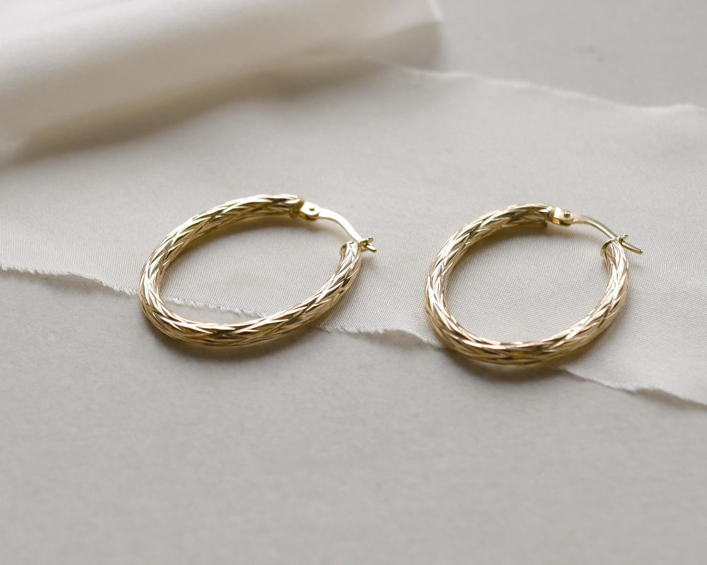 9ct gold textured oval hoop earrings