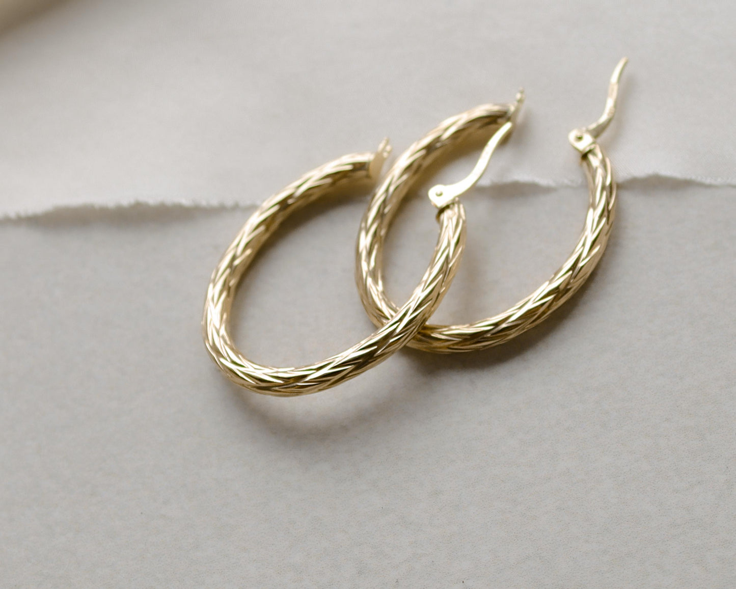 9ct gold textured oval hoop earrings