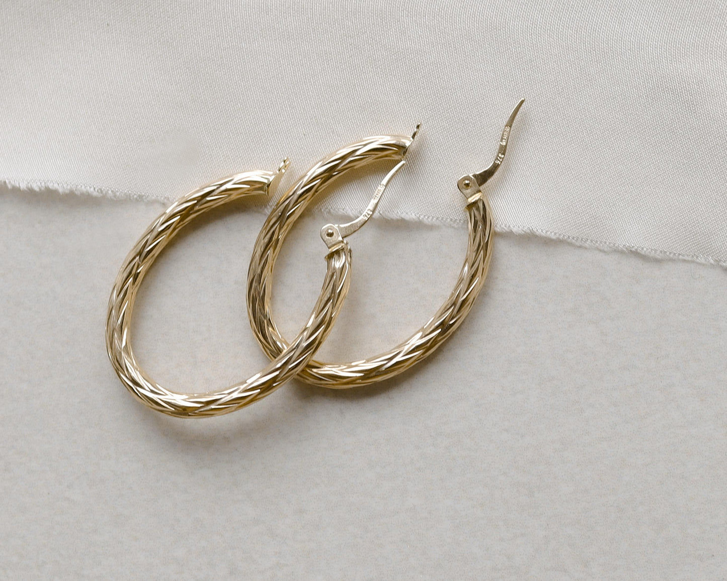 9ct gold textured oval hoop earrings