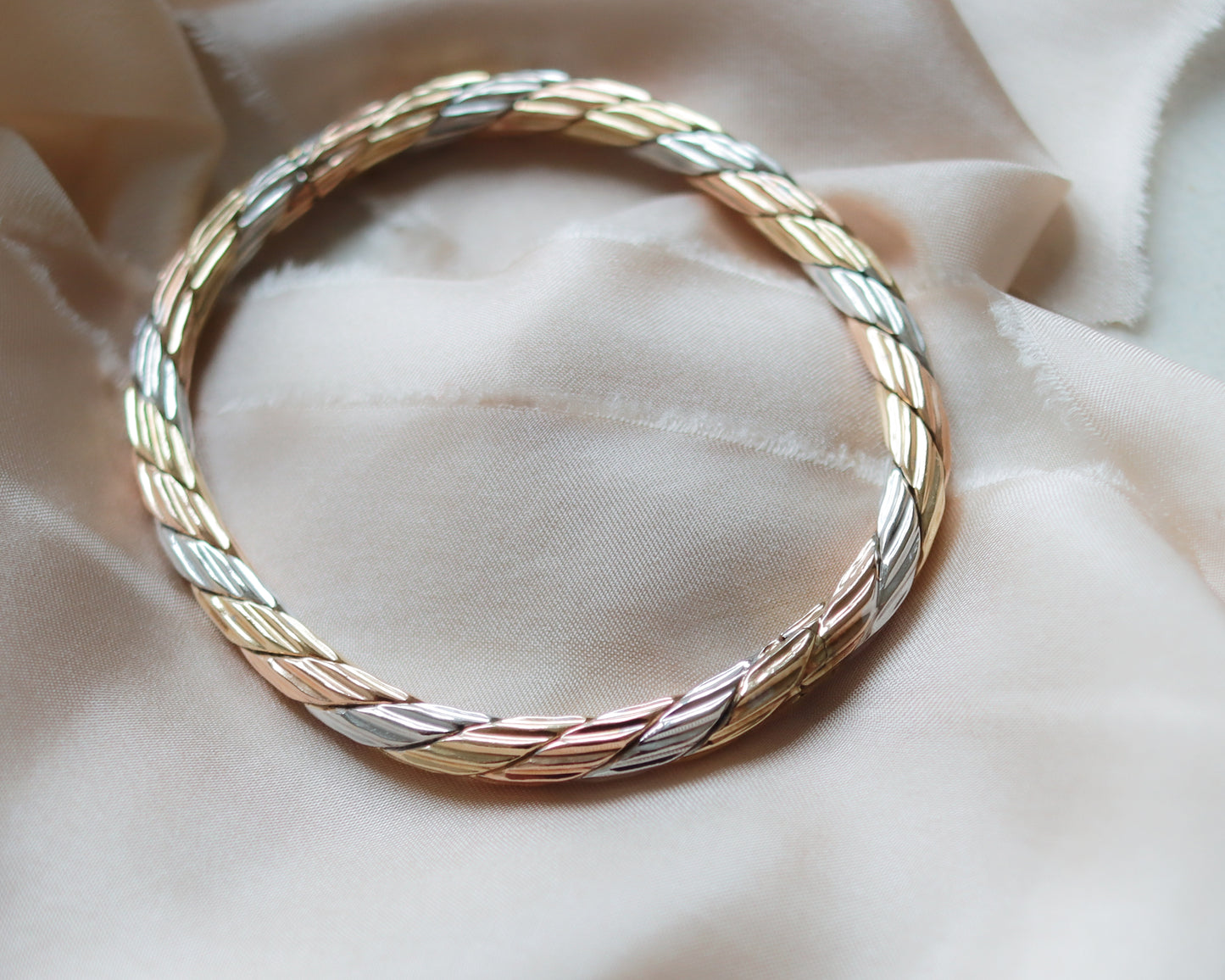 solid gold tri-coloured oval bangle