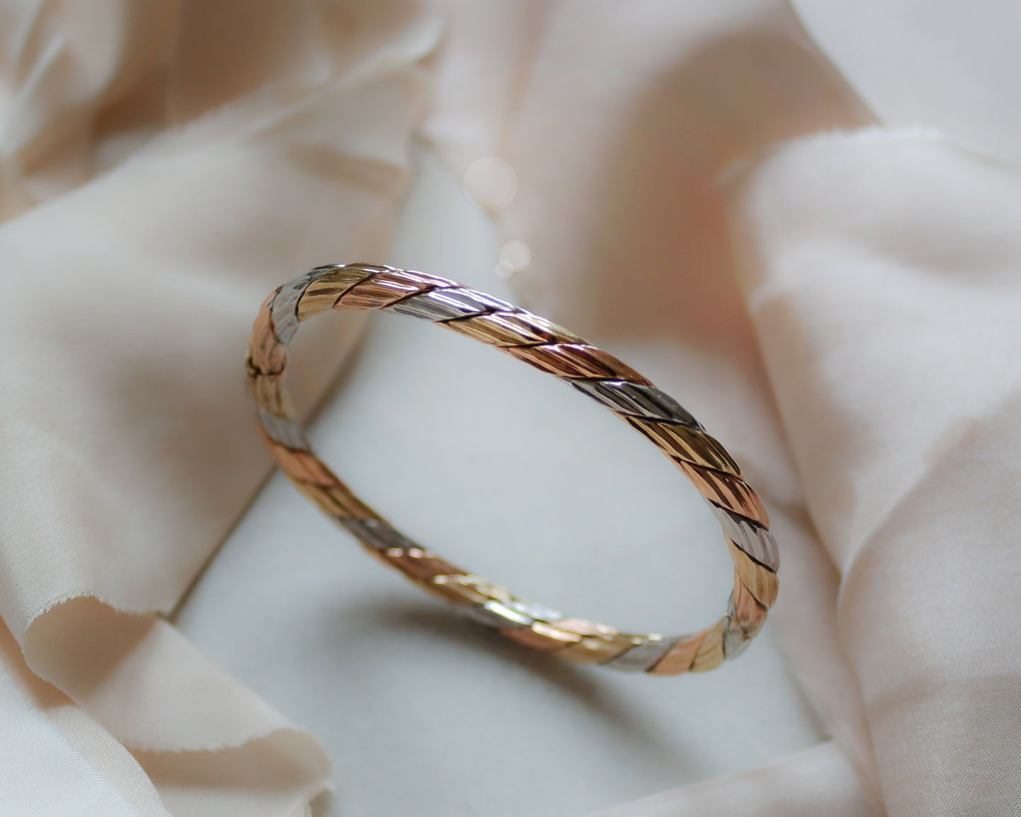solid gold tri-coloured oval bangle