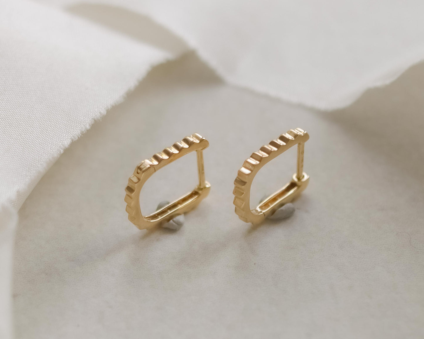 14ct gold early Messika huggie earrings